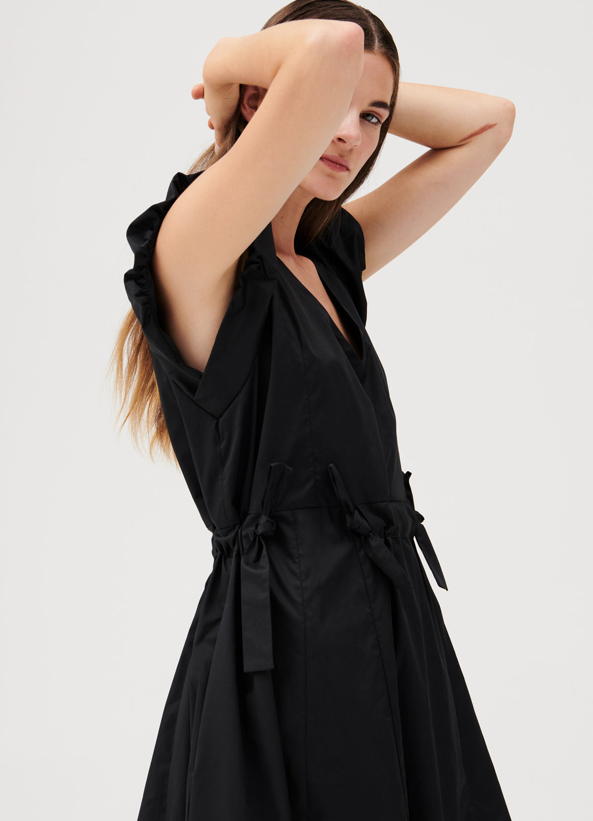 Cuspi Journey Tie Dress in Black featuring frill sleevs and a tie waist. Shop local and explore the latest collection of trans-seasonal styles designed and made in Melbourne, Australia.